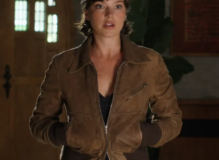 A woman wearing a brown leather jacket styled with a soft inner lining and modern fit, inspired by a TV series character outfit.